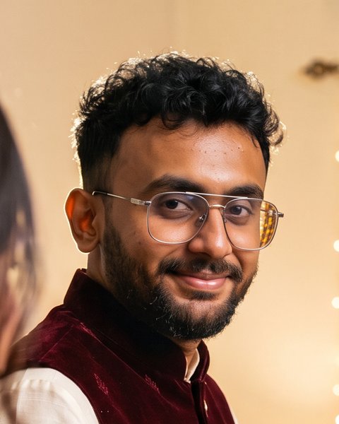 Faraz in an off-white kurta and maroon waistcoat
